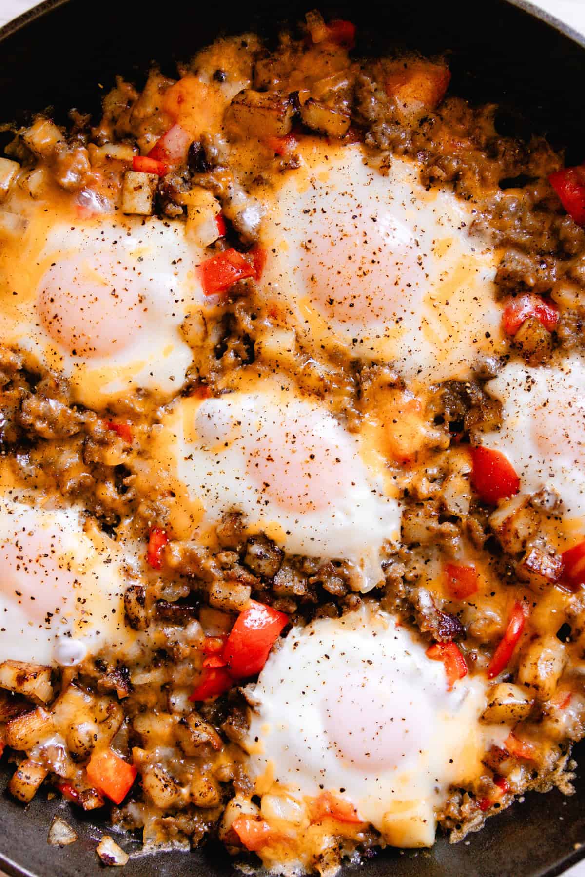 Sausage breakfast skillet ready to serve in a cast iron skillet.