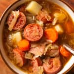 Polish Sauerkraut Soup in a small white bowl.