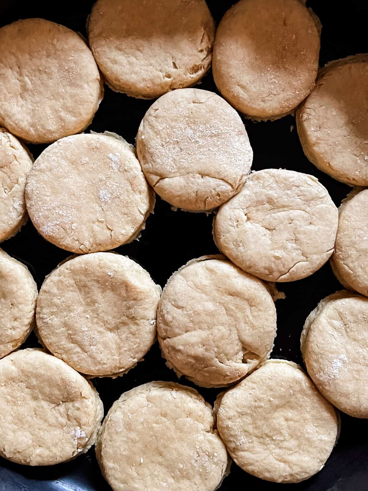 Whole grain biscuits in a cast iron skillet before being baked.