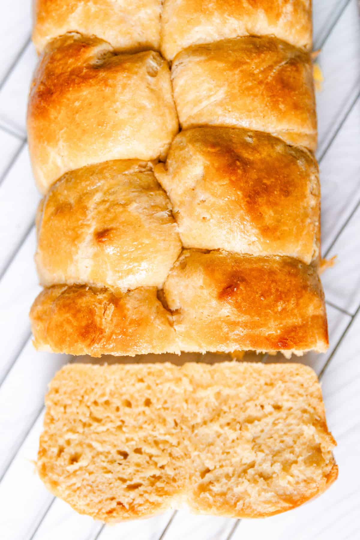 Whole grain brioche bread with a slice cut off.