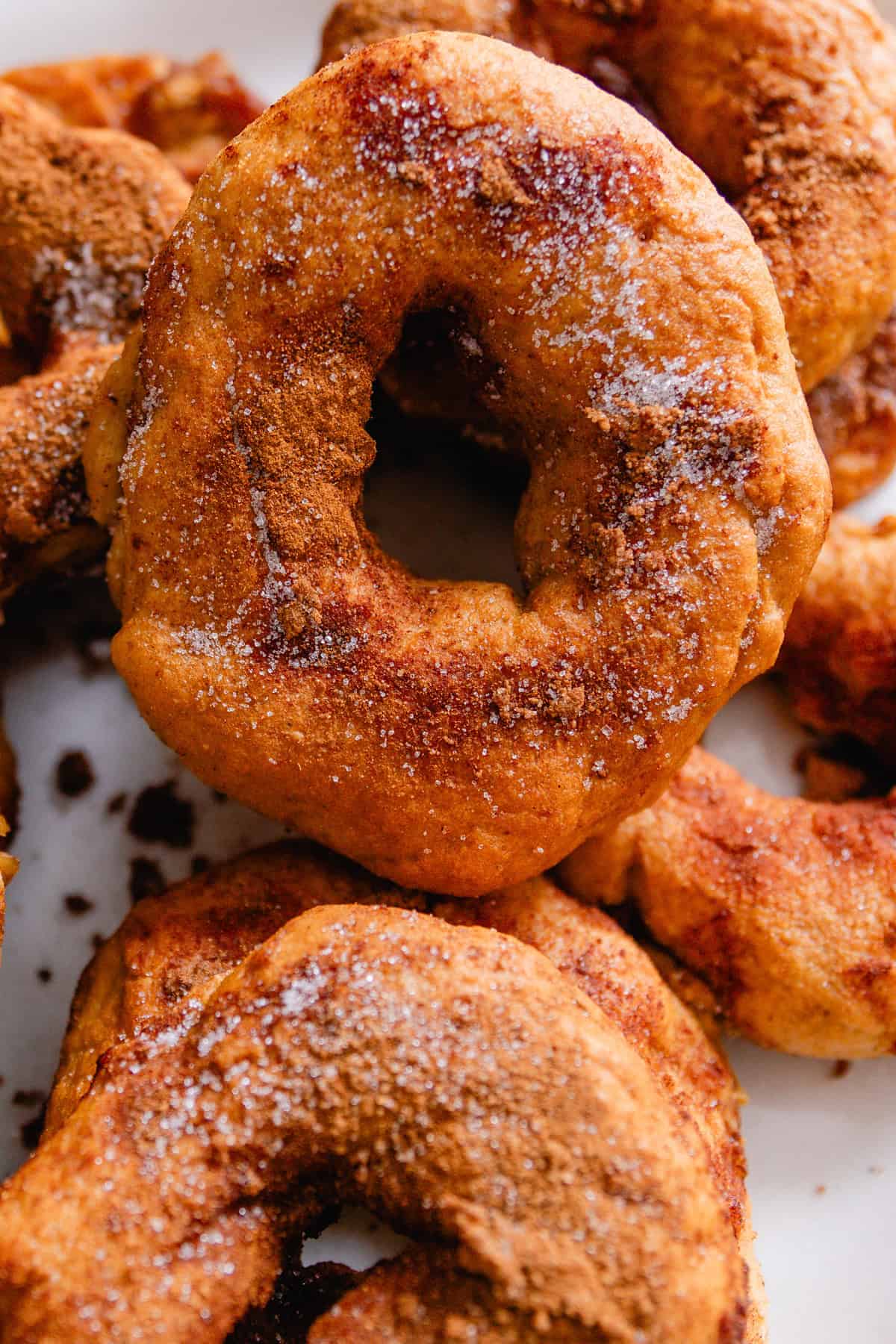 Cinnamon sugar bagels on a white plate.