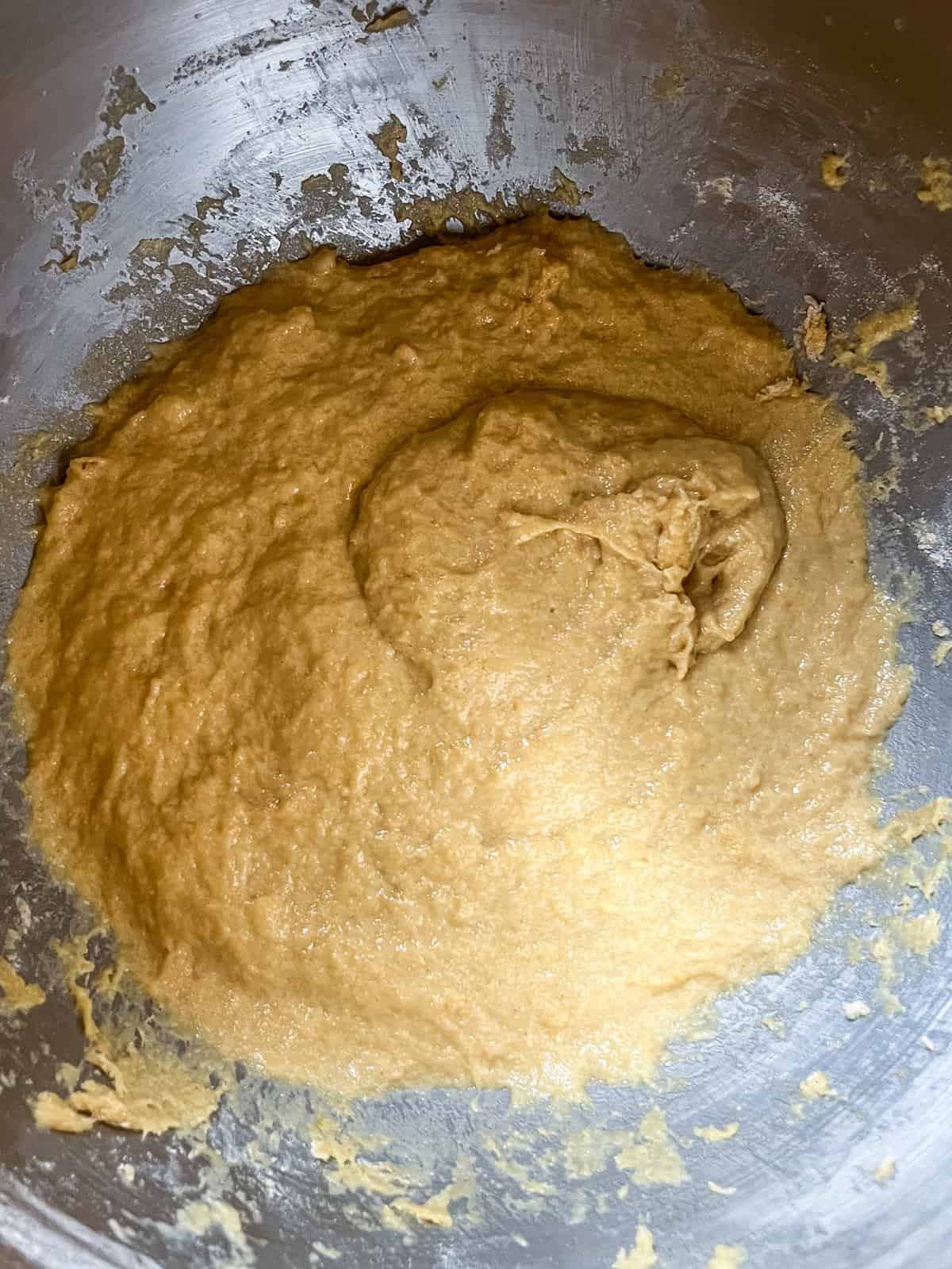 English muffin dough in a mixer bowl.