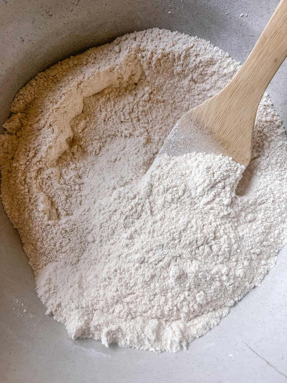 Mixing dry ingredients in a mixing bowl.