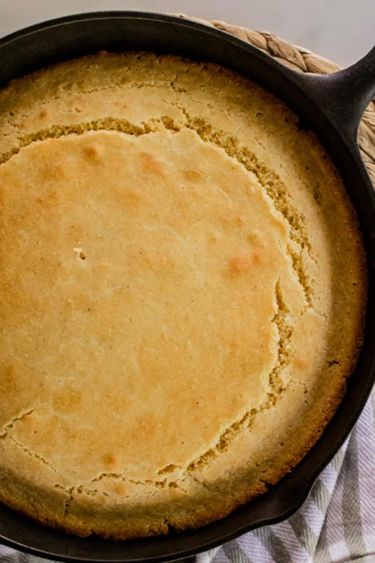A Cast Iron skillet filled with fresh Cornbread.