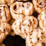 Whole grain cinnamon rolls drizzled with frosting.