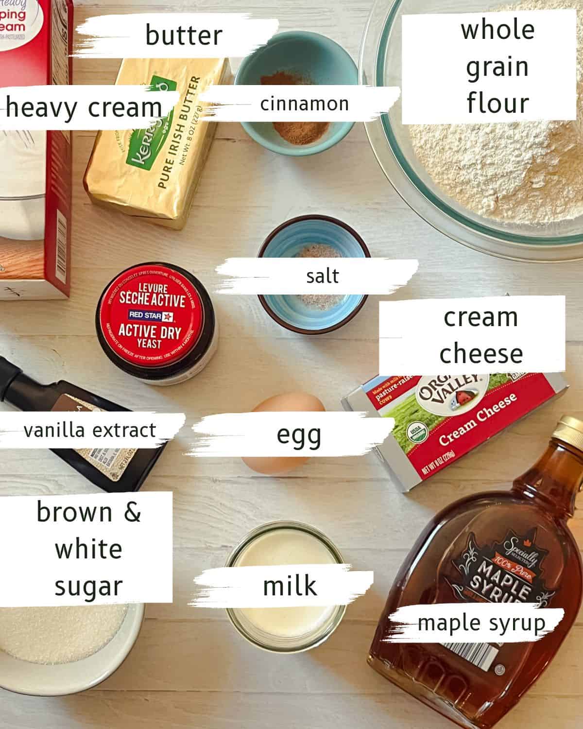 Whole grain cinnamon roll ingredients labeled on a white background.