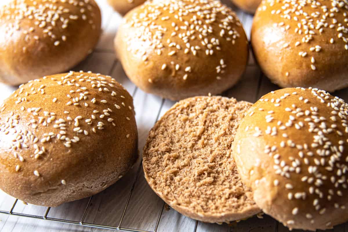 Whole grain buns on a cooling rack.