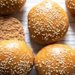 Whole grain buns on a cooling rack.