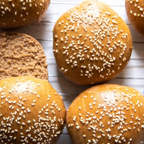 Whole grain buns on a cooling rack.