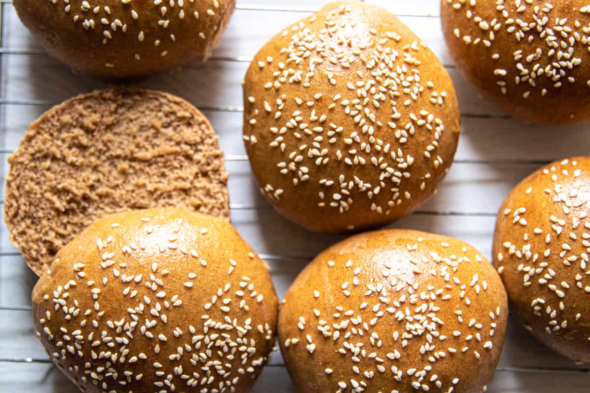 Whole grain buns on a cooling rack.