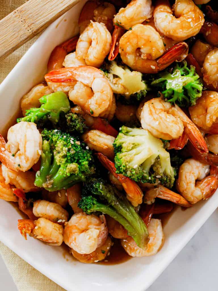 Shrimp and Broccoli Stir Fry piled high in a white serving dish.