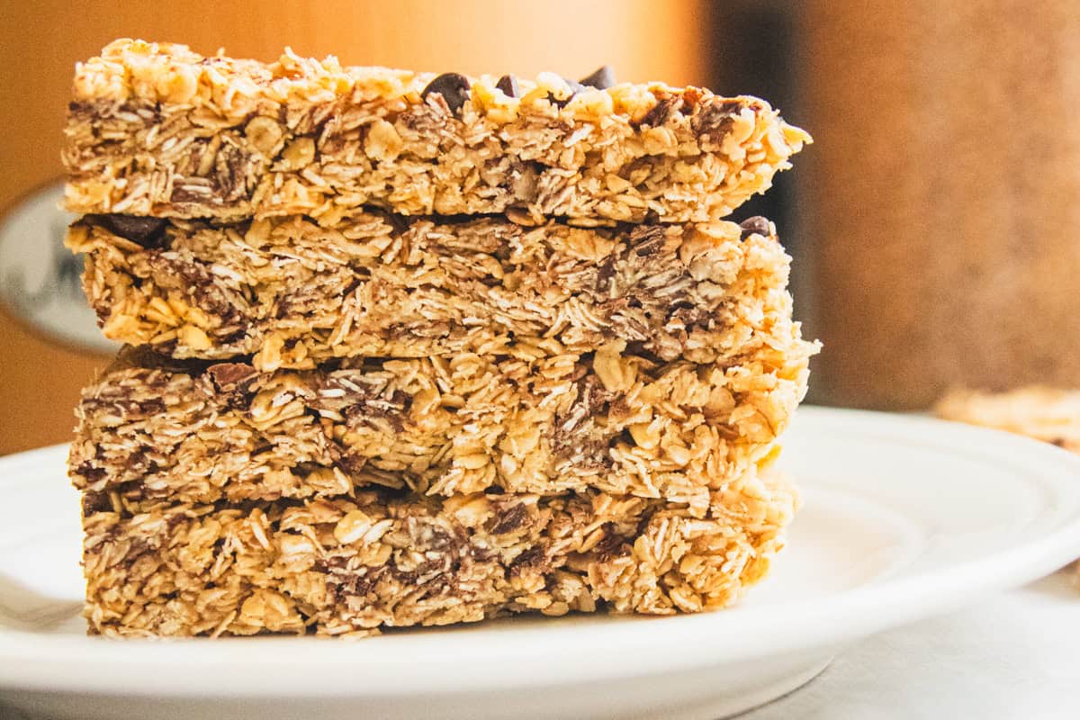 A stack of homemade granola bars on a plate.
