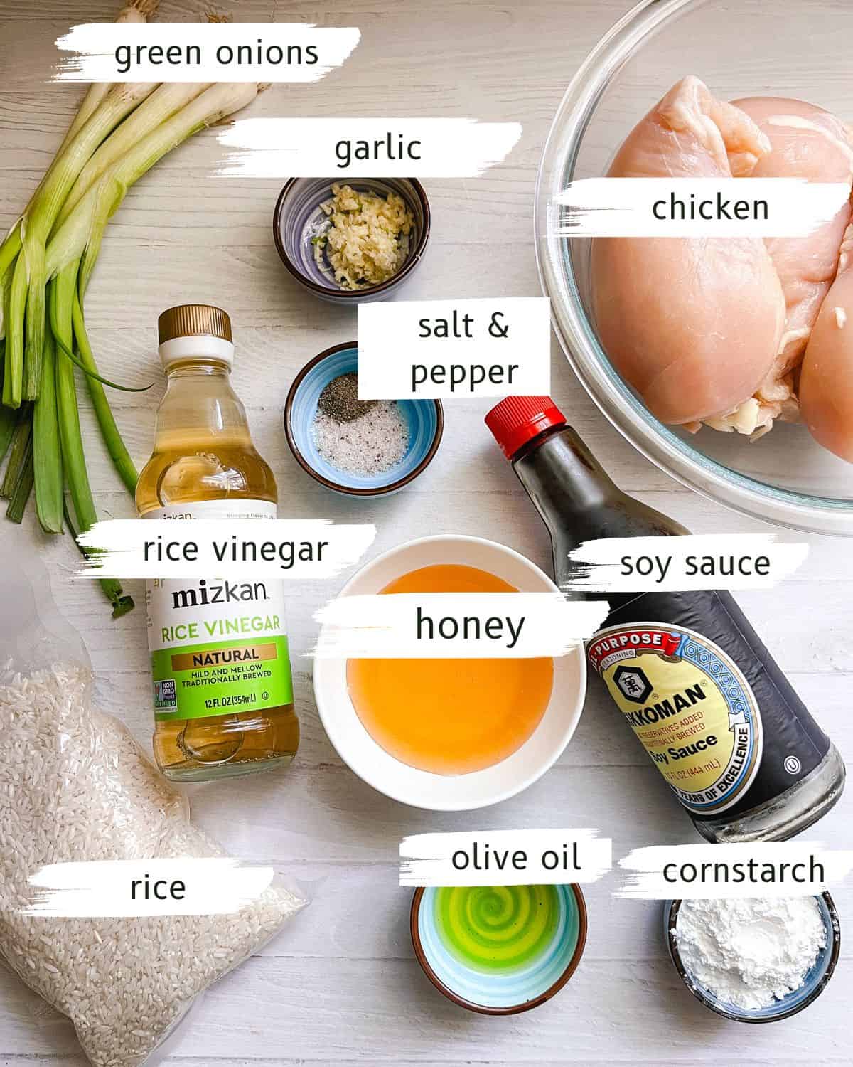 Honey garlic chicken ingredients labeled on a white table.
