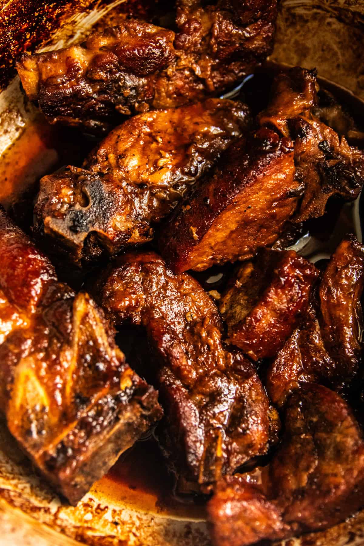 A close-up view of dutch oven country-style ribs.