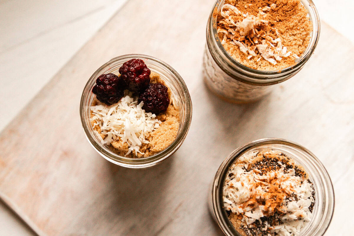 Three jars of overnight oats with different toppings on each.