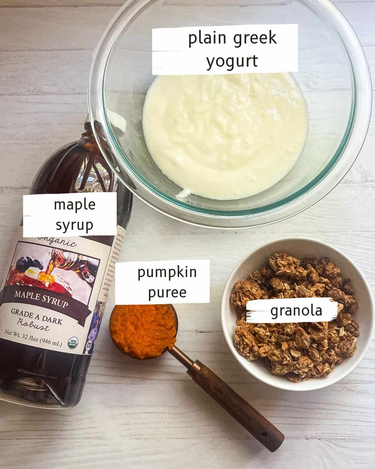 Pumpkin yogurt ingredients labeled on a white table. 