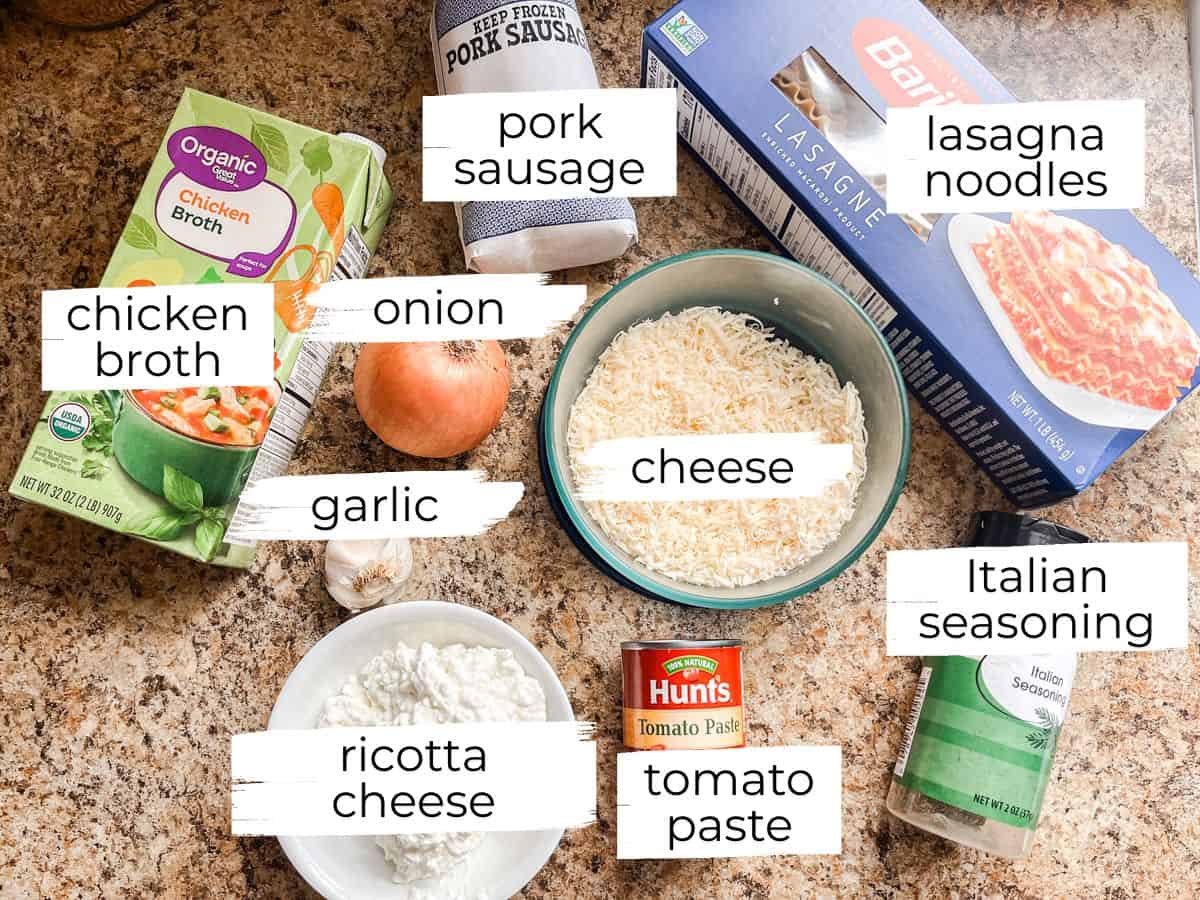 Lasagna soup ingredients labeled on a kitchen counter. 