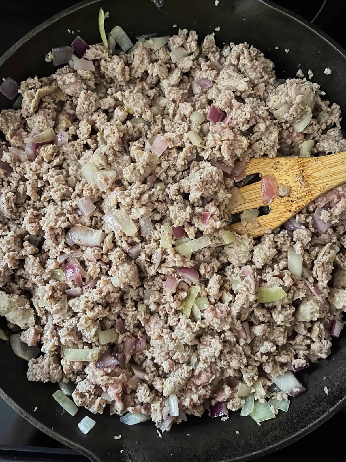 Browning sausage in a skillet. 