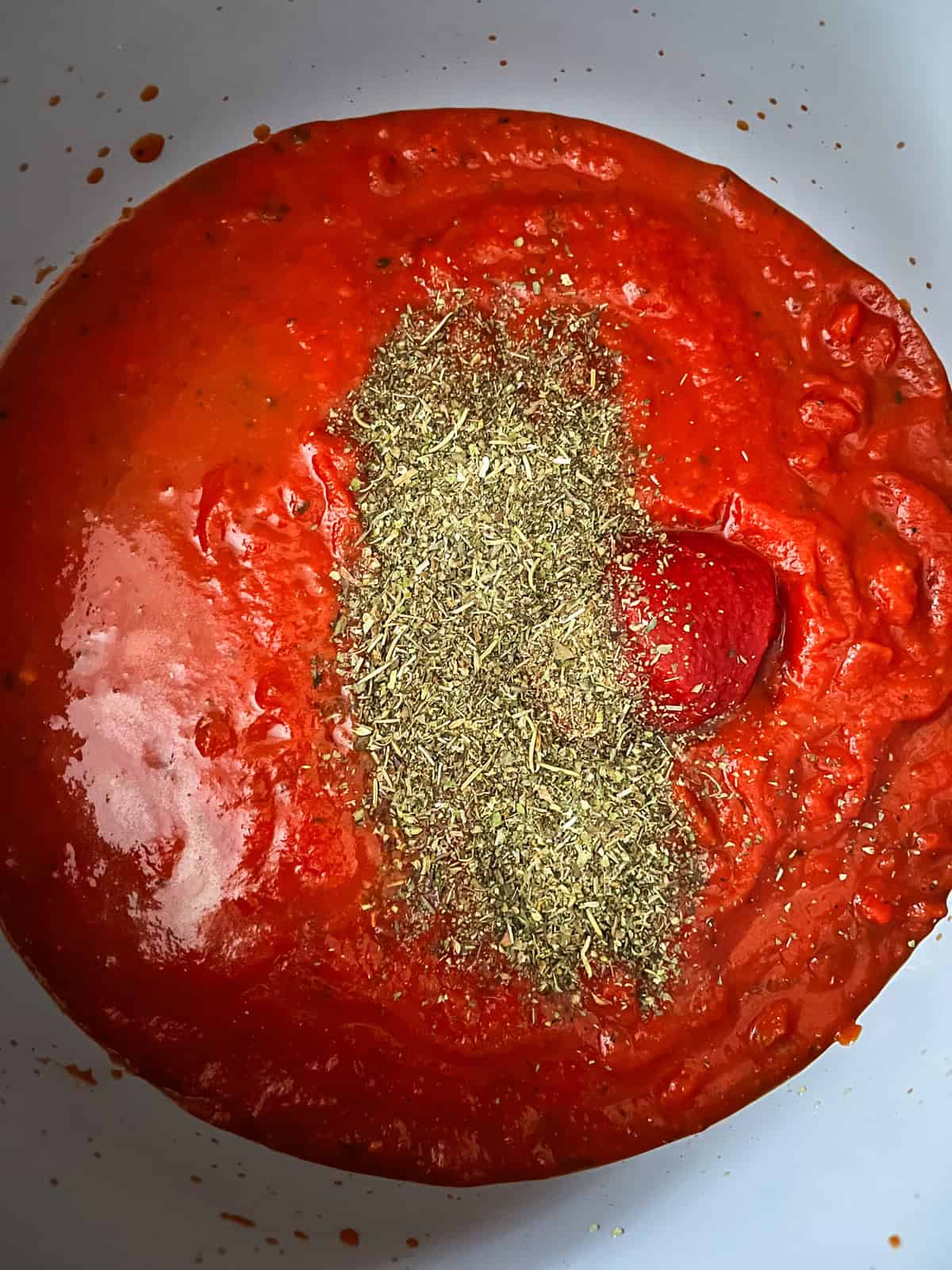 Marinara sauce and seasonings in a large dutch oven. 