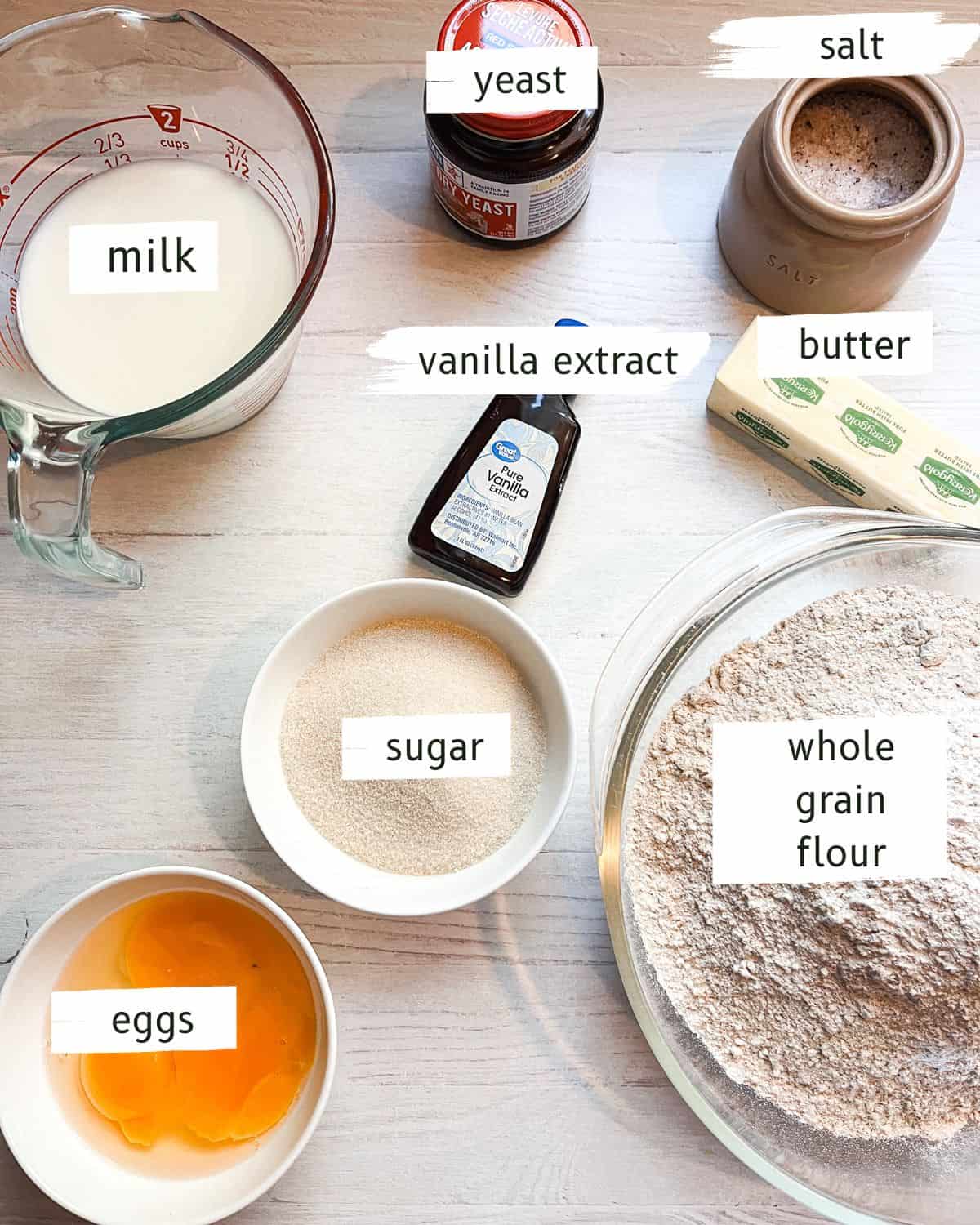 Whole grain long john donuts ingredients labeled on a white table. 