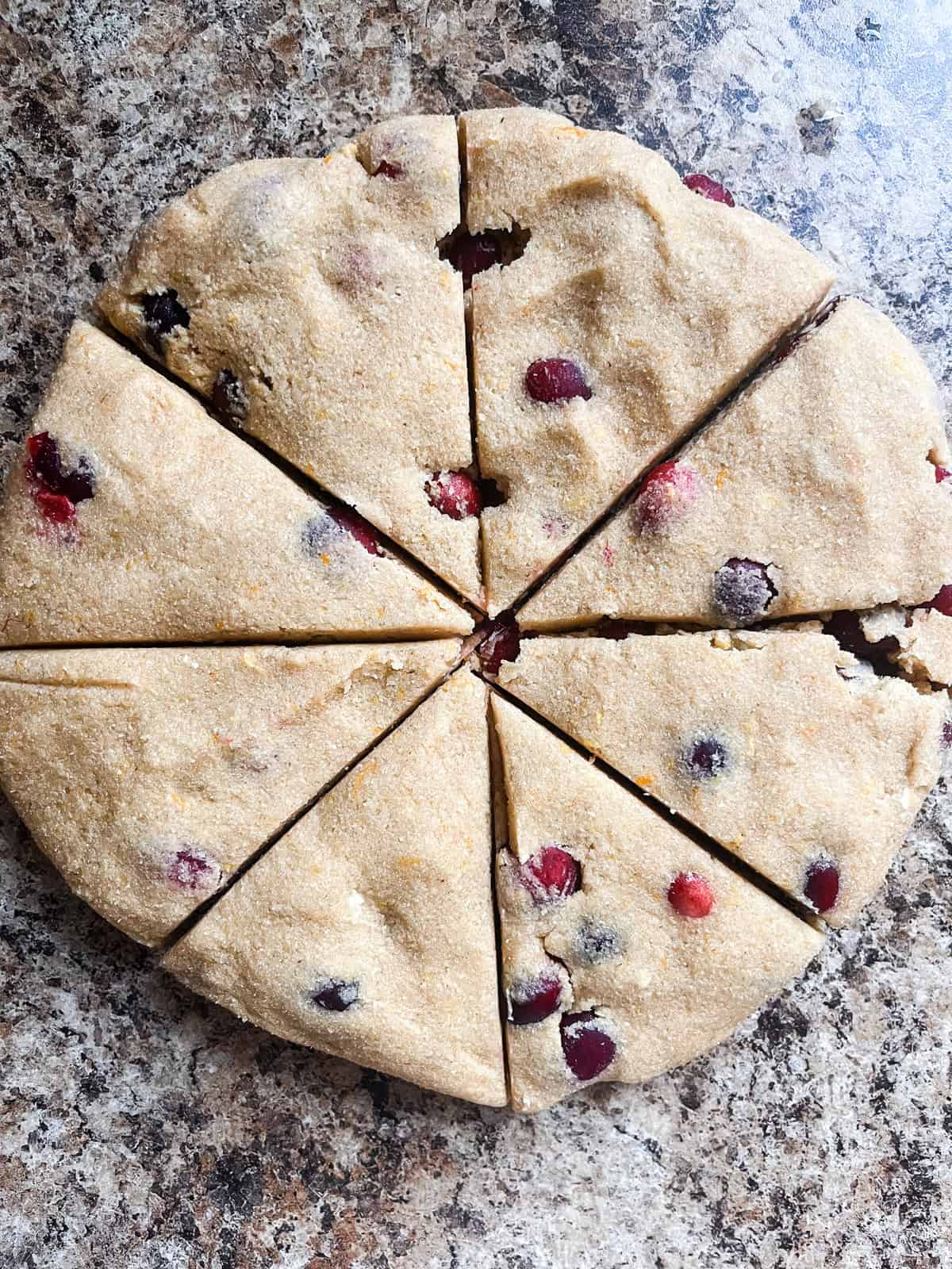 Scone disk cut into 8 triangle-shaped pieces.