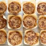 Freshly milled flour muffins cooling on a cooling rack.