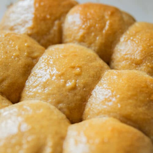 Fresh milled flour Hawaiian rolls cooling on a baking rack.