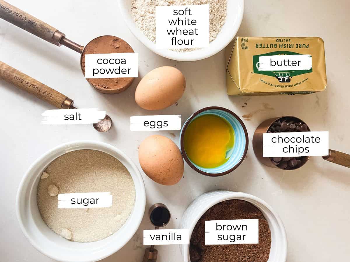 Brownies with fresh milled flour ingredients labeled on a white countertop.