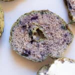 A sliced freshly milled blueberry bagel.
