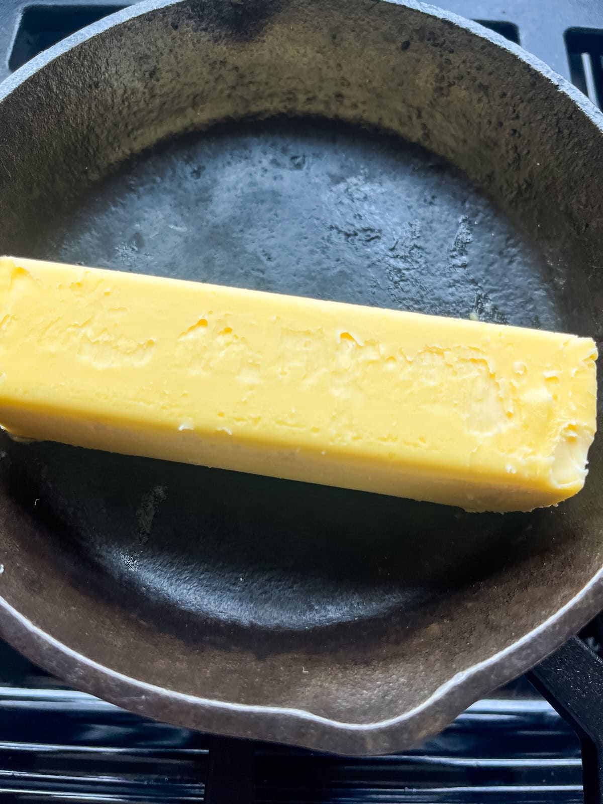 Melting butter in a cast iron skillet.