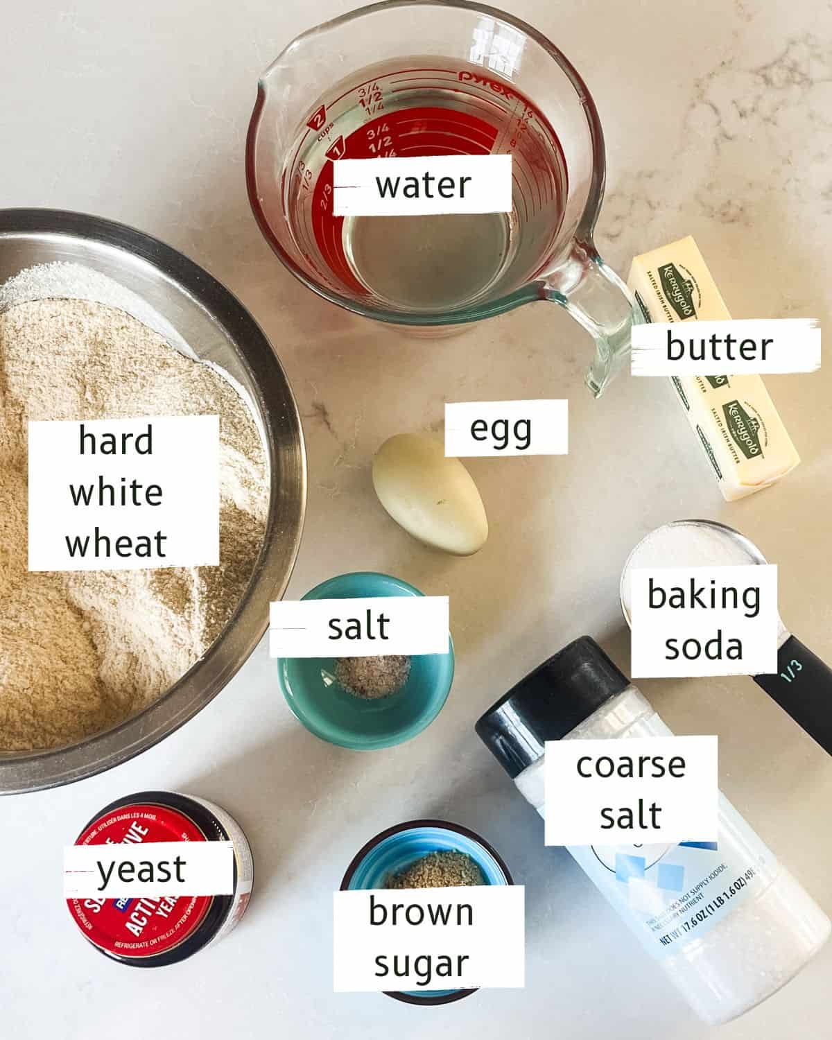 Fresh milled pretzel bites ingredients labeled on a white countertop.