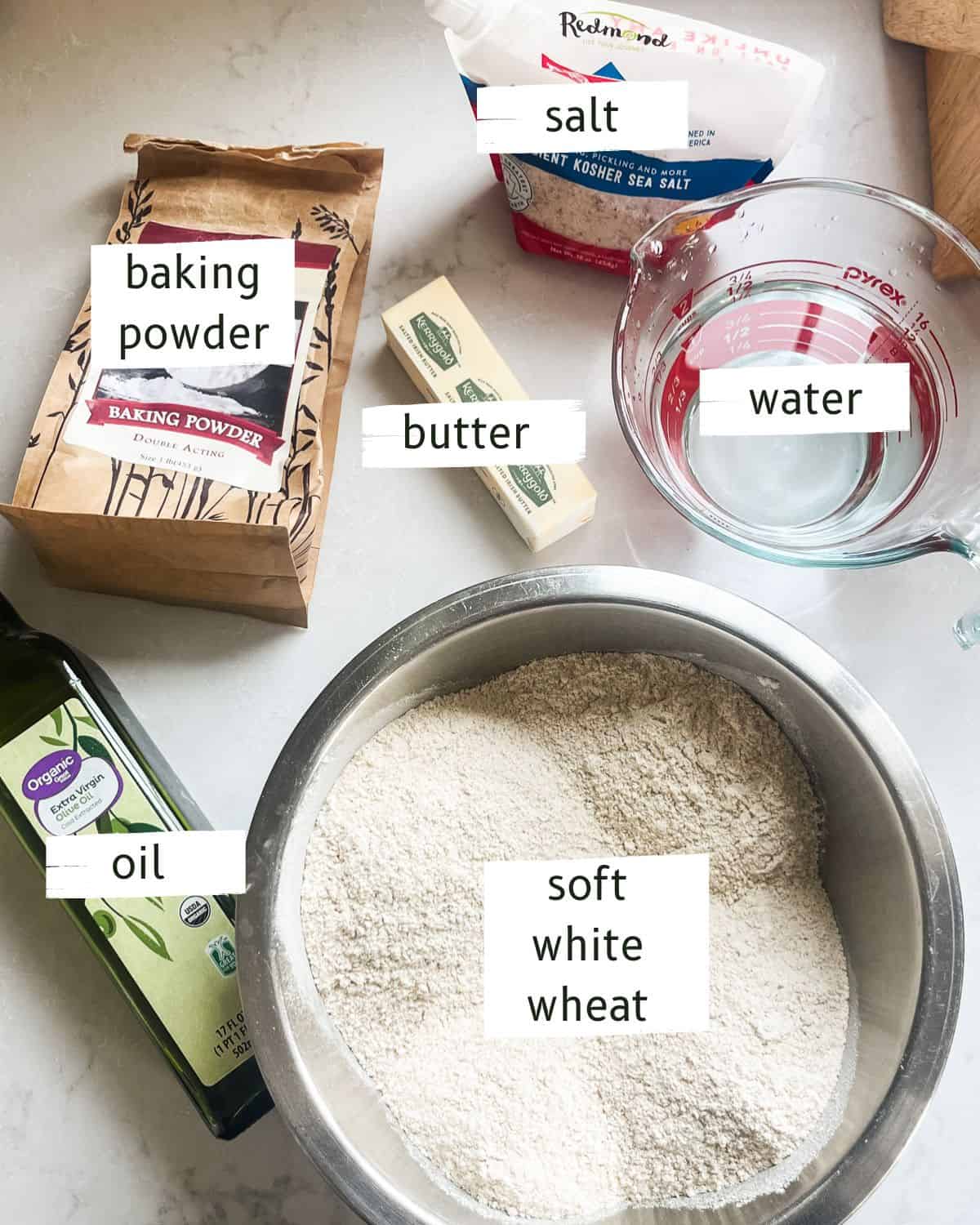 Freshly milled tortillas ingredients labeled on a white countertop.