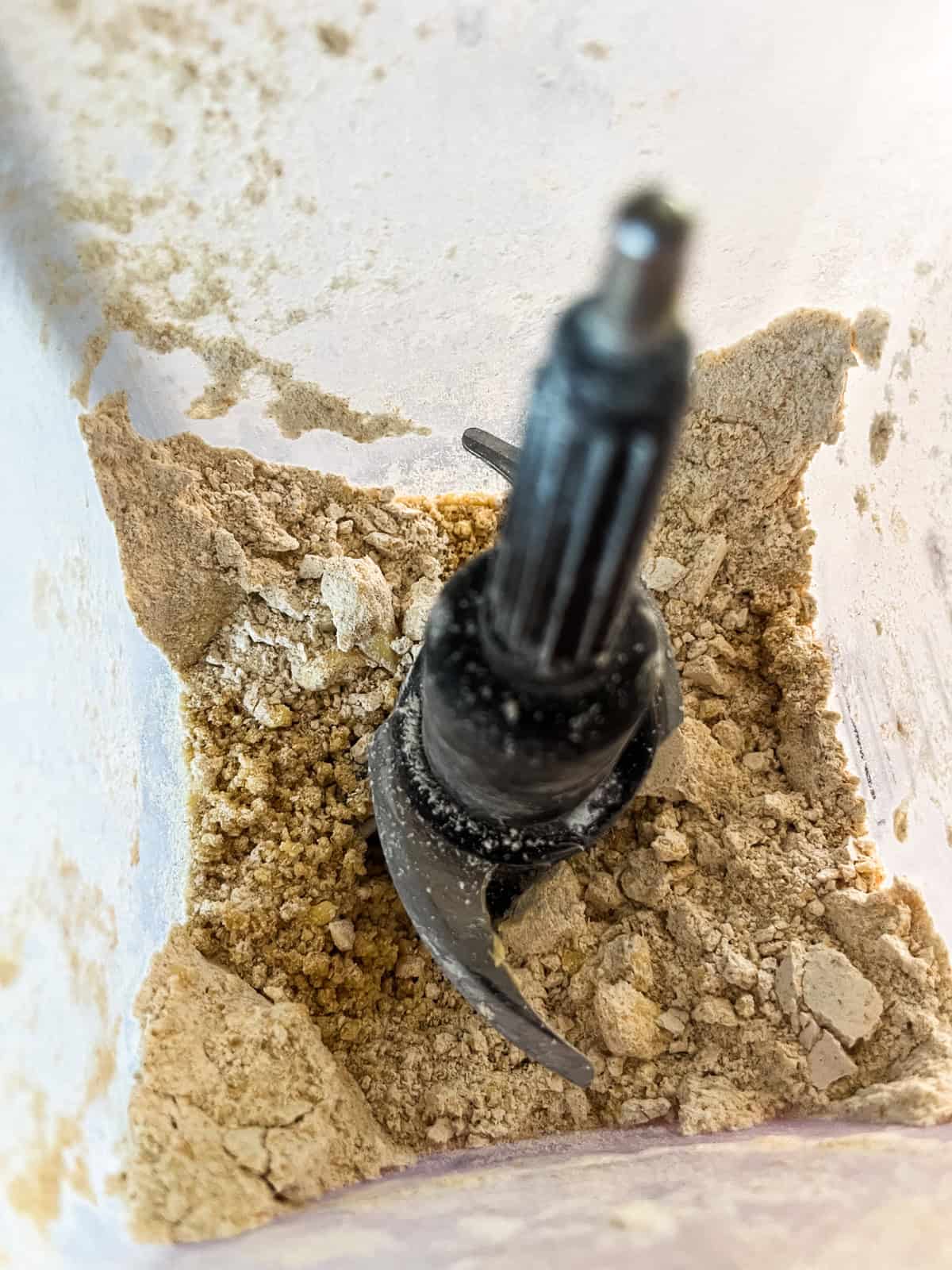 Dry ingredients and butter in a blender.