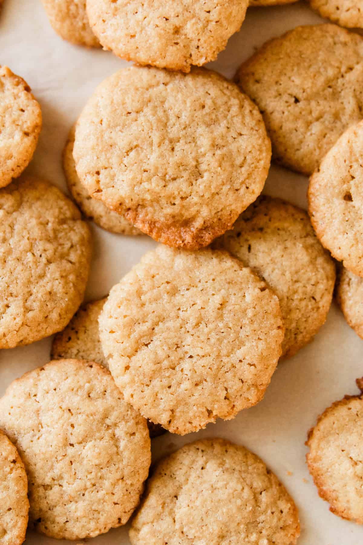 Fresh milled vanilla wafers stacked on a baking sheet.