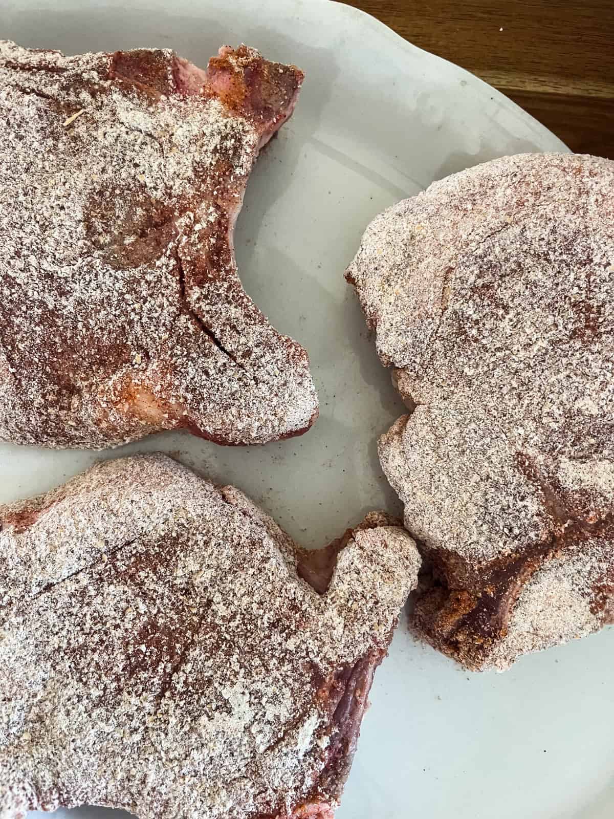 Pork chops coated with a flour mixture.