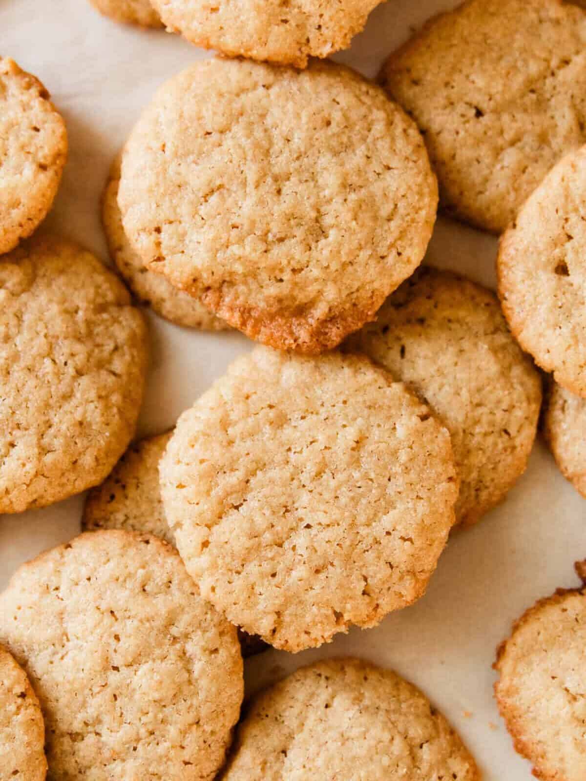 Fresh milled vanilla wafers stacked on a baking sheet.