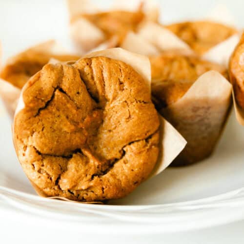 A white plate of peanut butter muffins.