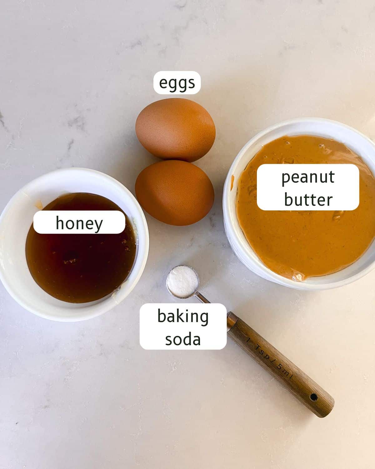 Peanut butter muffin ingredients labeled on a kitchen counter.