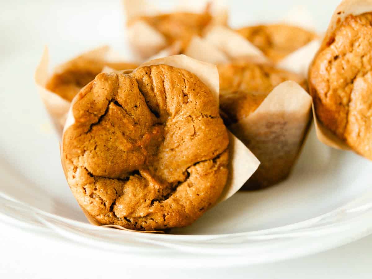 A white plate of peanut butter muffins.