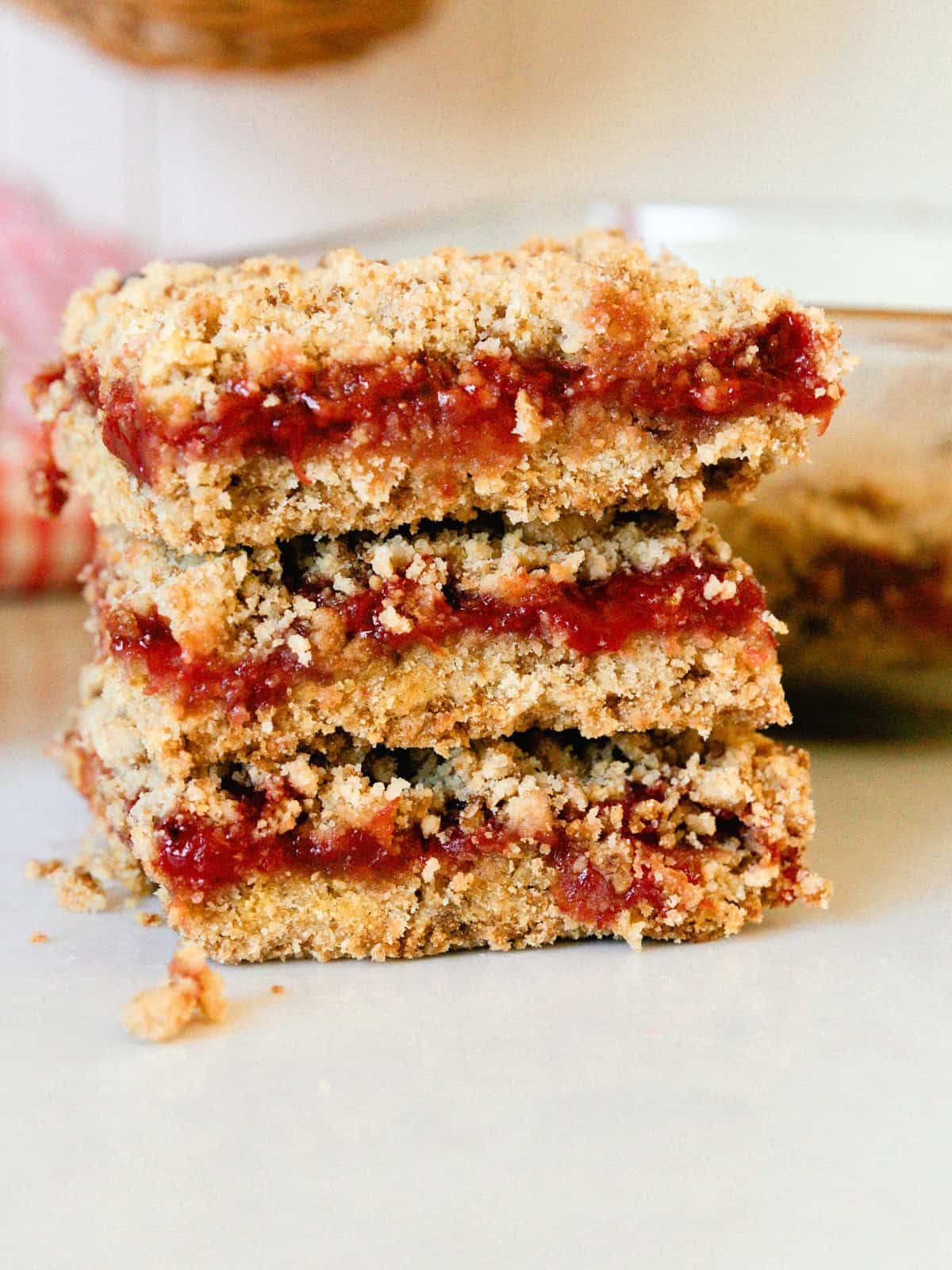 A stack of strawberry crumble bars.
