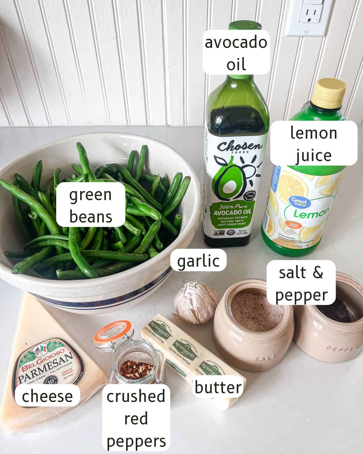 Ingredients for cast iron skillet green beans labeled on a kitchen counter.