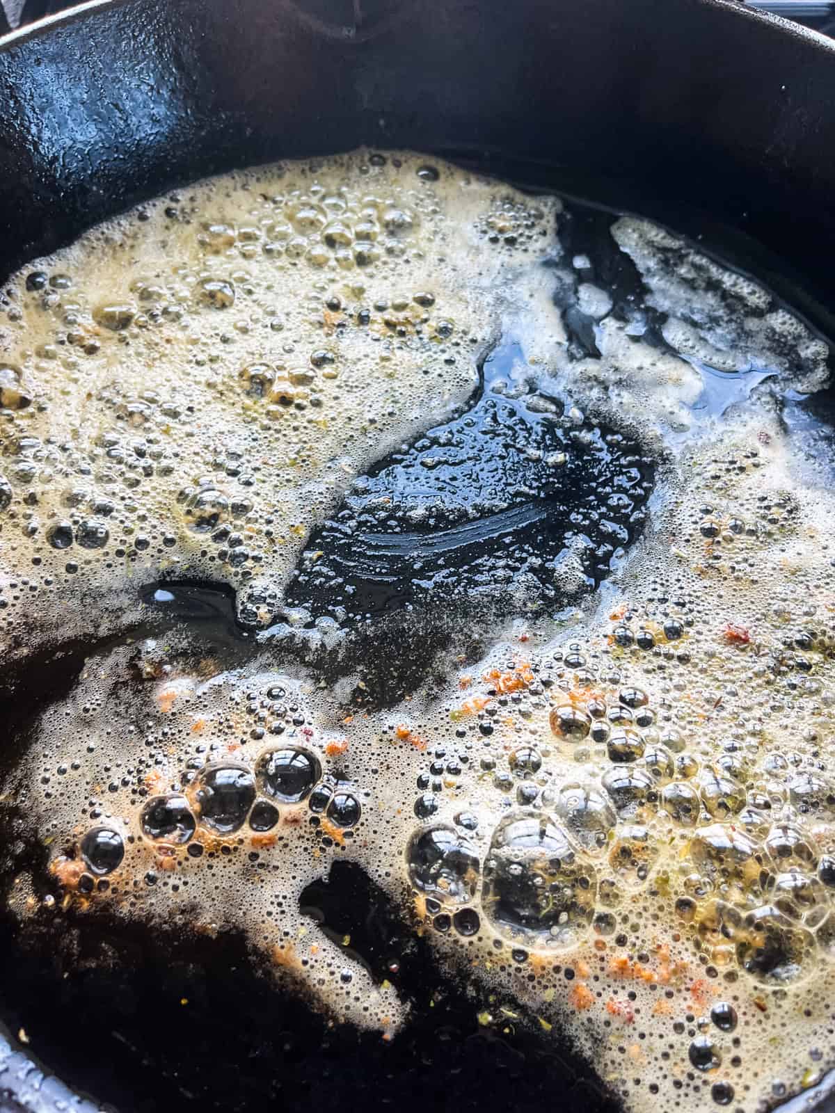 Melted butter in a cast iron skillet.