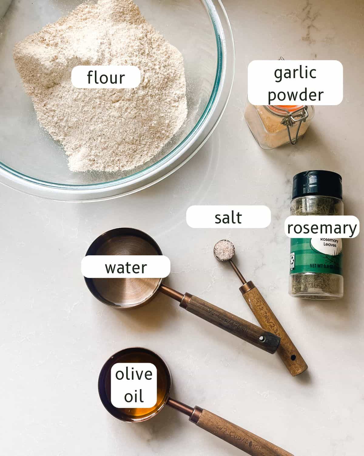 Fresh milled flour crackers ingredients labeled on a countertop.