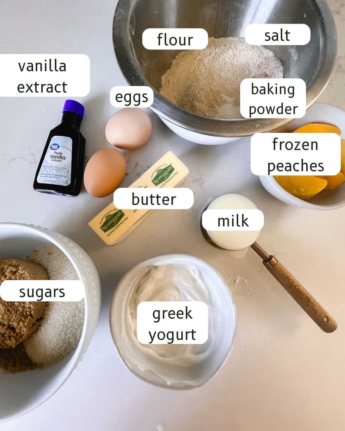 Peach upside down cake ingredients labeled on the kitchen counter.