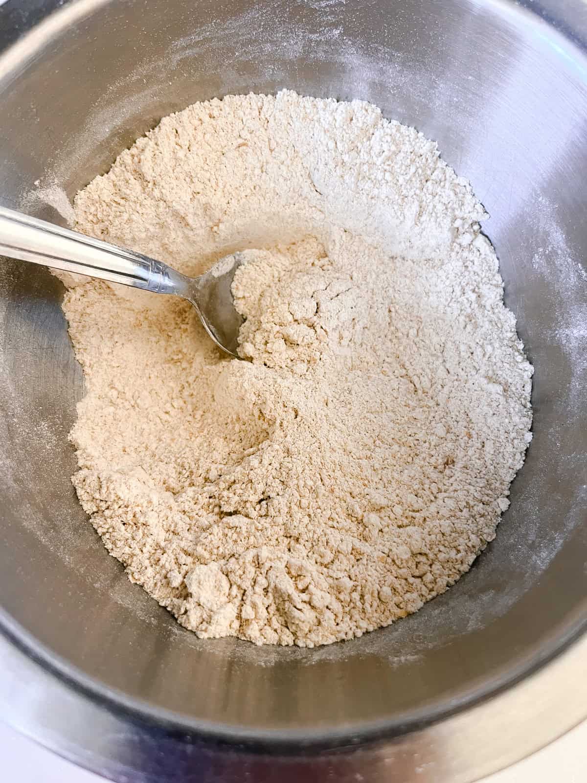 Mixing dry ingredients in a mixing bowl.