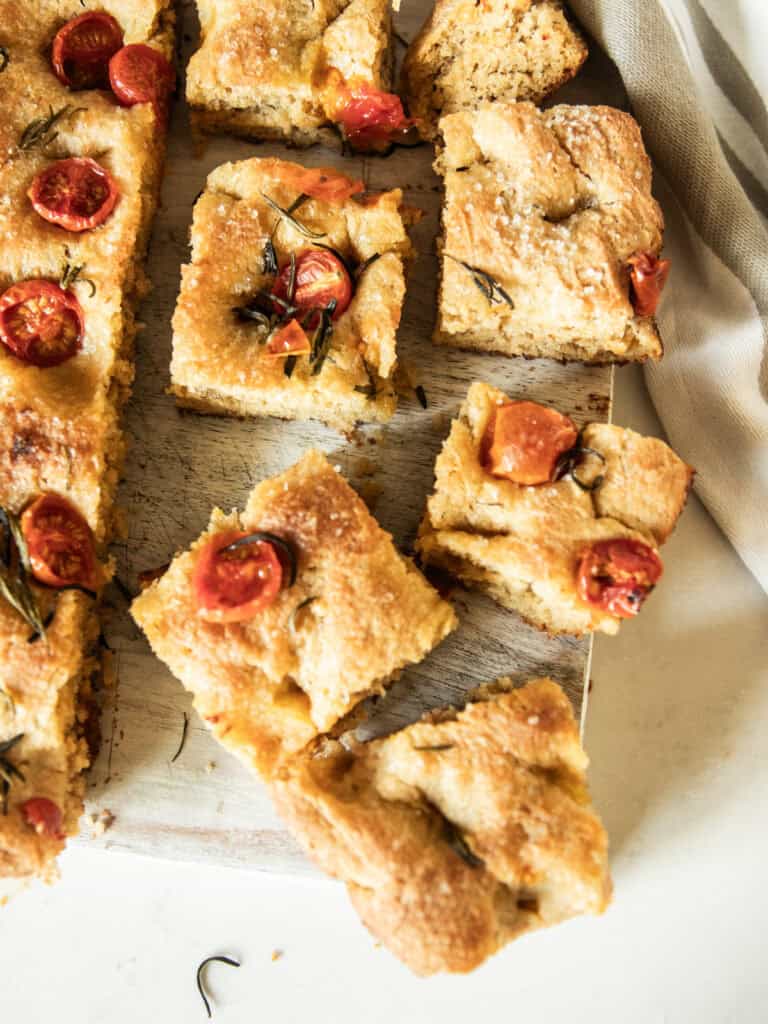 Freshly milled focaccia bread sliced into squares.