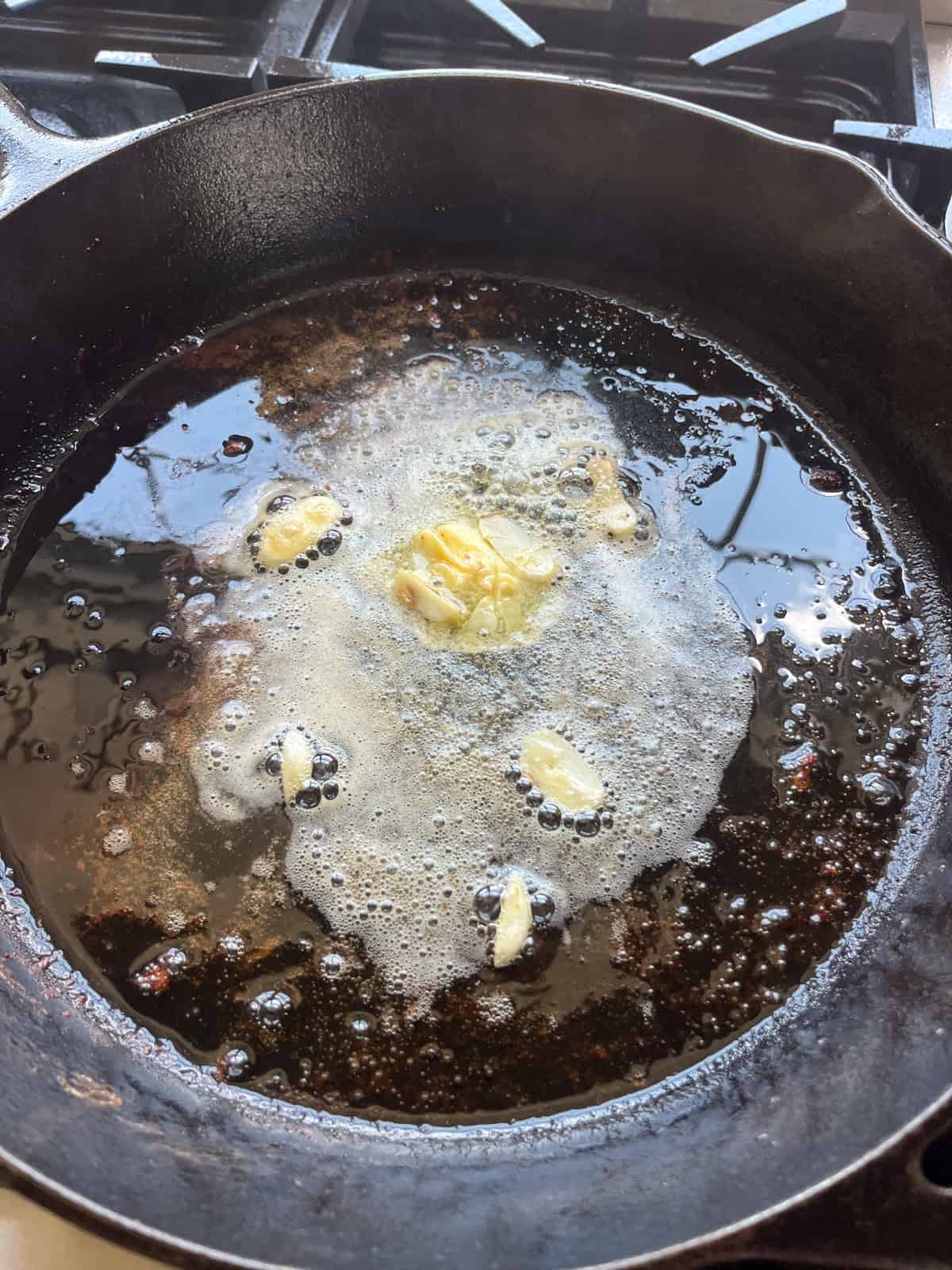 Butter melting in a cast iron skillet.