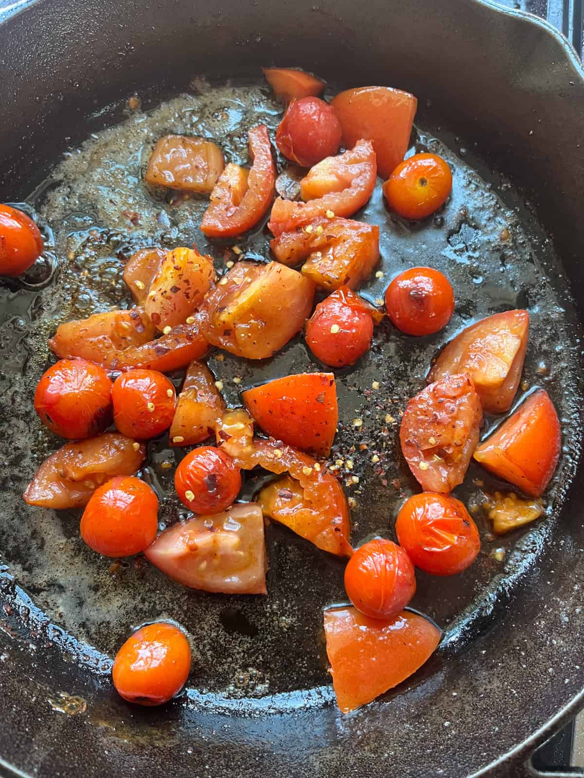 Cherr ytomatoes in a cast iron skillet.