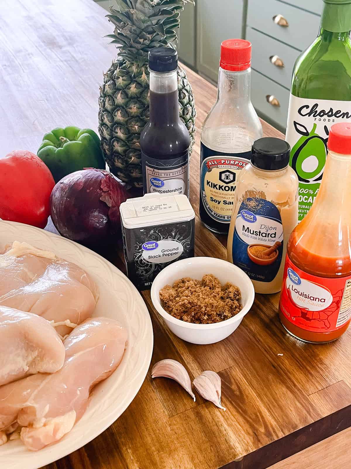 Hawaiian chicken kabobs ingredients on a kitchen counter.