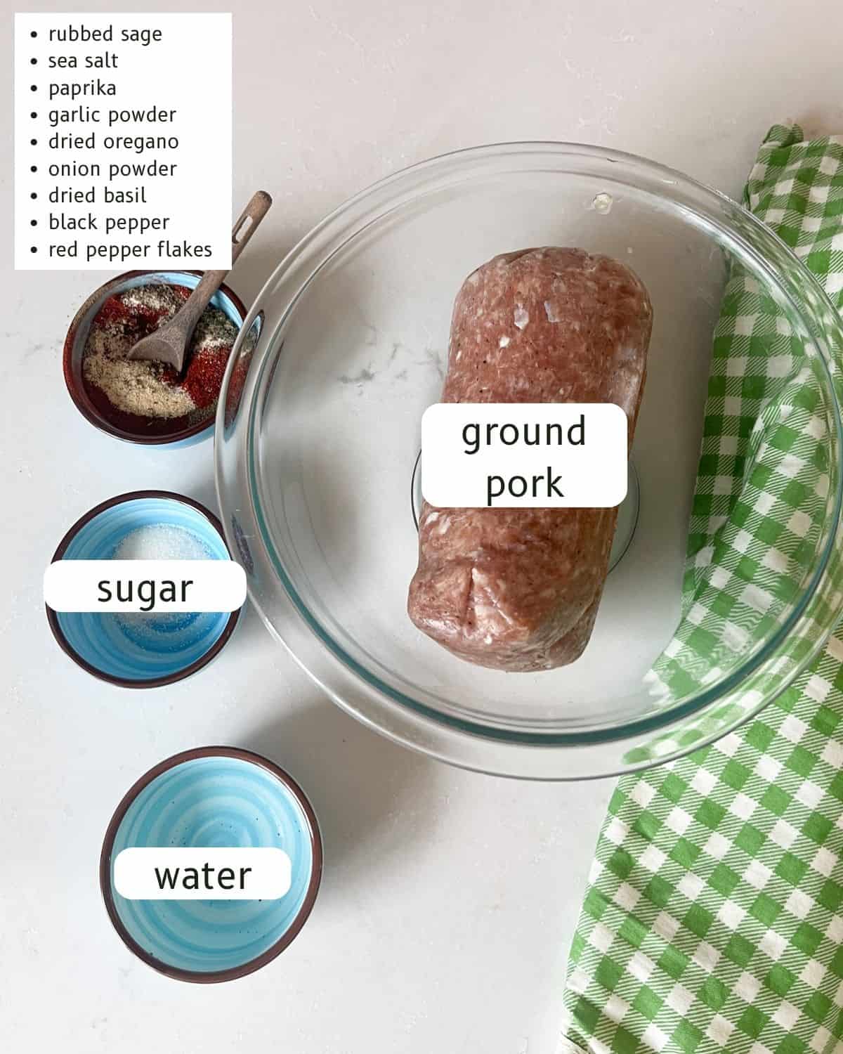 Homemade breakfast sausage patties ingredients assembled and labeled.